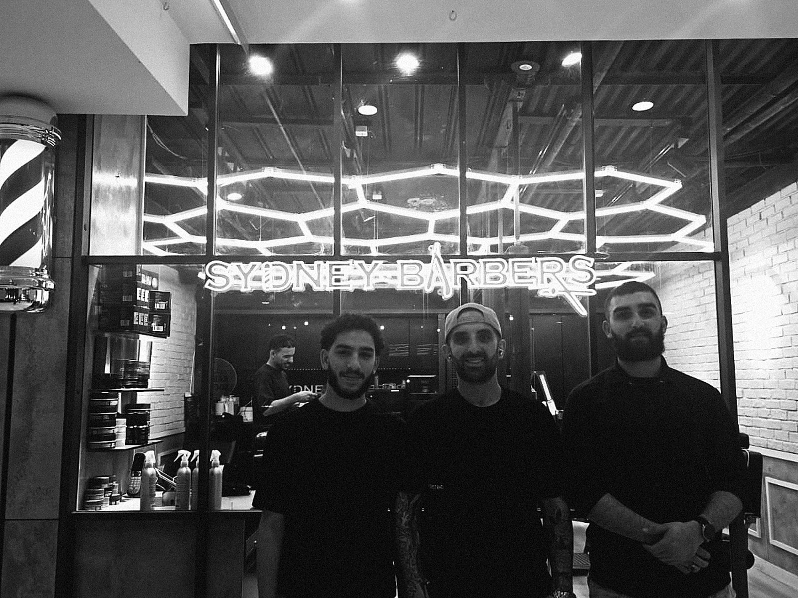 The Sydney Barbers team in front of the shop